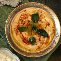 Hummus · Chickpeas, lemon juice, garlic, tahini and olive oil. Vegan.