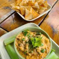 Buffalo Chicken Dip · Smoked Chicken, Classic Buffalo sauce, Cream Cheese with Chips and Celery