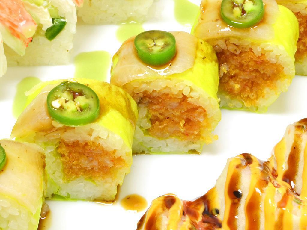 KC Roll Special · Spicy yellowtail and crunch wrapped in soy paper topped with jalapeno , yellowtail, and citrus sauce.