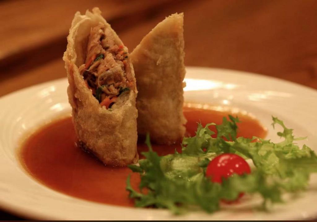Duck Spring Roll · Crispy pancakes wrapped with duck meat, cucumber and scallion serve with hoi sin sauce.