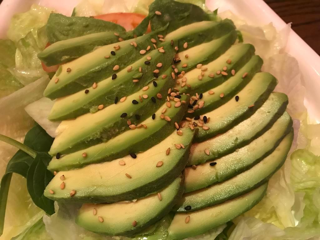Avocado Salad · Avocado and salad with ginger dressing on the side.
