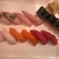 Sushi Deluxe · 10 pieces of assorted raw fish on seasoned rice and tuna roll.