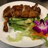 Half Duck · Crispy roasted duck, seasoned vegetables and hoisin sauce. Served with miso soup, salad and ...