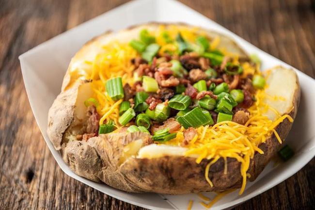 BAKED POTATO · Baked Potato loaded with butter, sour cream, cheese, fresh bacon bits and chives