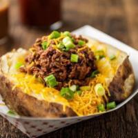 CHOPPED BAKER · Baked Potato loaded with butter, sour cream, cheese and chives and a quarter pound of our ch...
