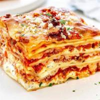 HOMEMADE MEAT LASAGNA · Our Homemade Lasagna is prepared fresh in the morning daily. Comes with Bread.