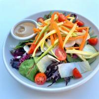 Mix Green Salad · Mixed greens with tomatoes, endive, radicchio & fresh julienne vegetables, served with our h...