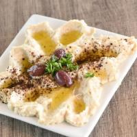 Baba Ghanouj · Roasted eggplant medley with sesame paste, yogurt, and garlic.
Served with one flatbread