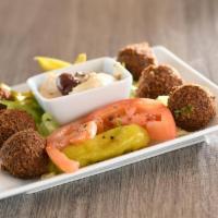 Falafel Appetizer · Six golden chickpea fritters served with tahini sesame sauce.