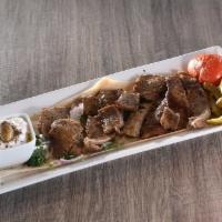 Gyro entree · Generous portion of blended lamb and beef. Served with Greek tzatziki sauce.