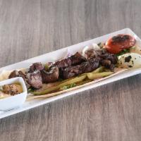 Lamb Tikka Plate · 2 skewers of tender marinated lamb medallions.
Served with one flatbread
Add an extra sauce ...