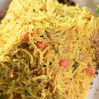 Biryani · Iraqi style vegetarian rice made from basmati rice, mixed vegetables, and aromatic spices.