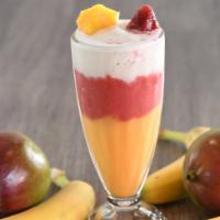 Shisha Rainbow Smoothie · Layered fresh fruit smoothie containing bananas, mangoes, berries, and pineapple.
