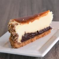 Turtle Cheesecake · Cheesecake with nuts, caramel, and chocolate.