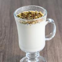 Sahlab · Hot drinkable dessert made from milk, sugar, rose water, starch, and topped with pistachios.