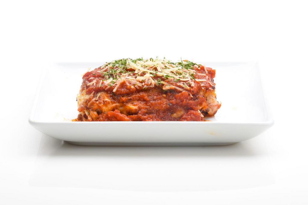 Homemade Meat Lasagna · Layers of pasta with meat sauce, melted mozzarella and ricotta cheese. Served with garlic bread.