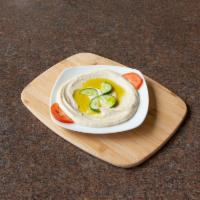 Hummus · Garbanzo, tahini, fresh lemon juice, garlic and extra virgin olive oil. Vegan, vegetarian an...