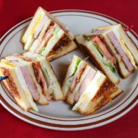 Breakfast Club · A classic club sandwich style layered with eggs, ham, bacon, lettuce, and tomatoes on three ...