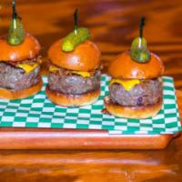 Cheeseburger Slider · A trio of Kobe beef mini burgers, melted cheddar, Swiss and pepper jack cheese, topped with ...