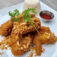 Hat Yai Fried Chicken · Authentic Thai marinated fried bone-in chicken top with crispy shallots. Served with steamed...