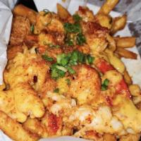 Lobster Cheesy Fries · Chunks of lobster meat served over fries and topped with our house cheesy sauce. Topped with...