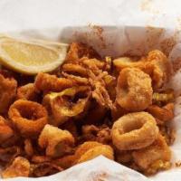 Spicy Calamari · Fresh calamari, hand-breaded and tossed with banana peppers before
frying it all to perfecti...