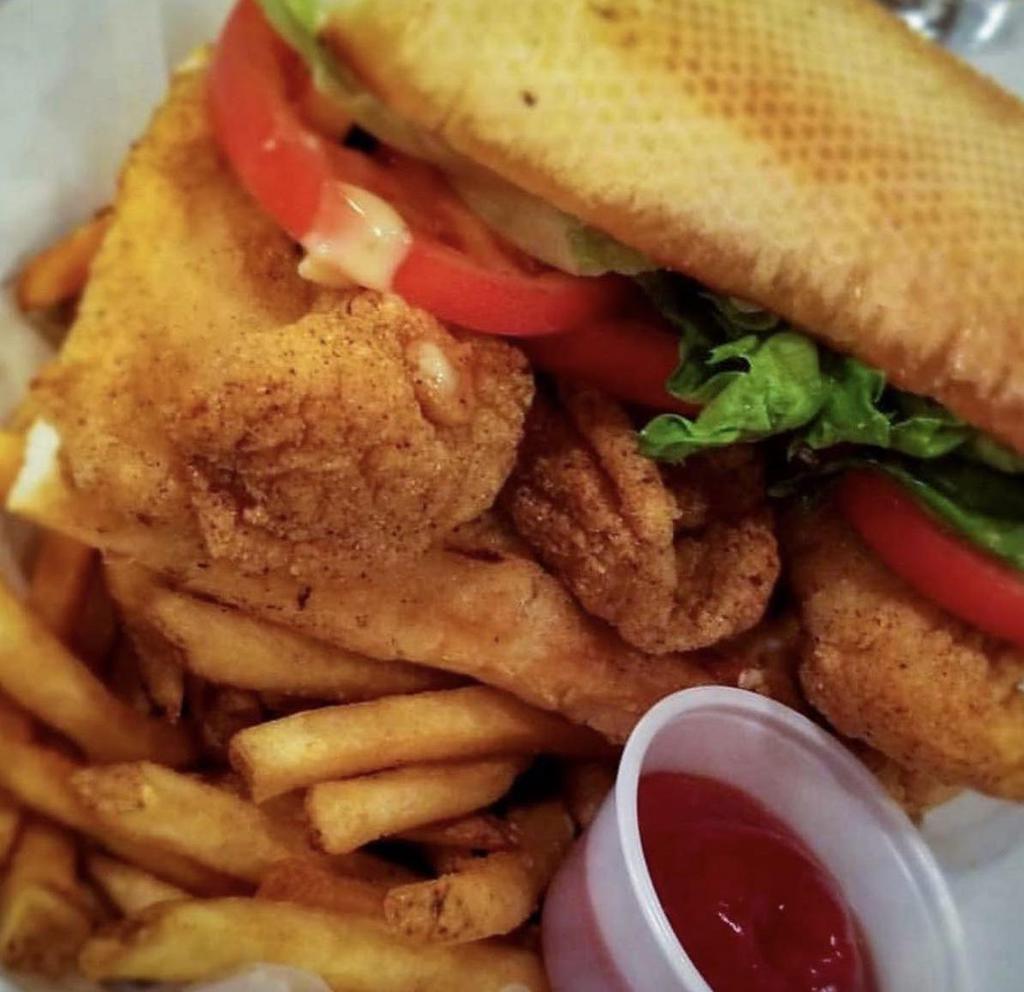 Fried Catfish Sandwich · Fresh catfish is moist, sweet with a firm flesh and less flake,
hand-battered and fried to perfection. Served on bread with lettuce, tomato, and house Cajun Aioli