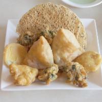 Mixed Appetizer for 2 · A combination of vegetable samosas, pakoras and papadam.