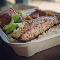 Mediterranean Salmon · Salmon filet served on a bed of rice 