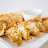 Man Doo · Pot stickers that can be served with soy sauce or vons special spicy sauce. 