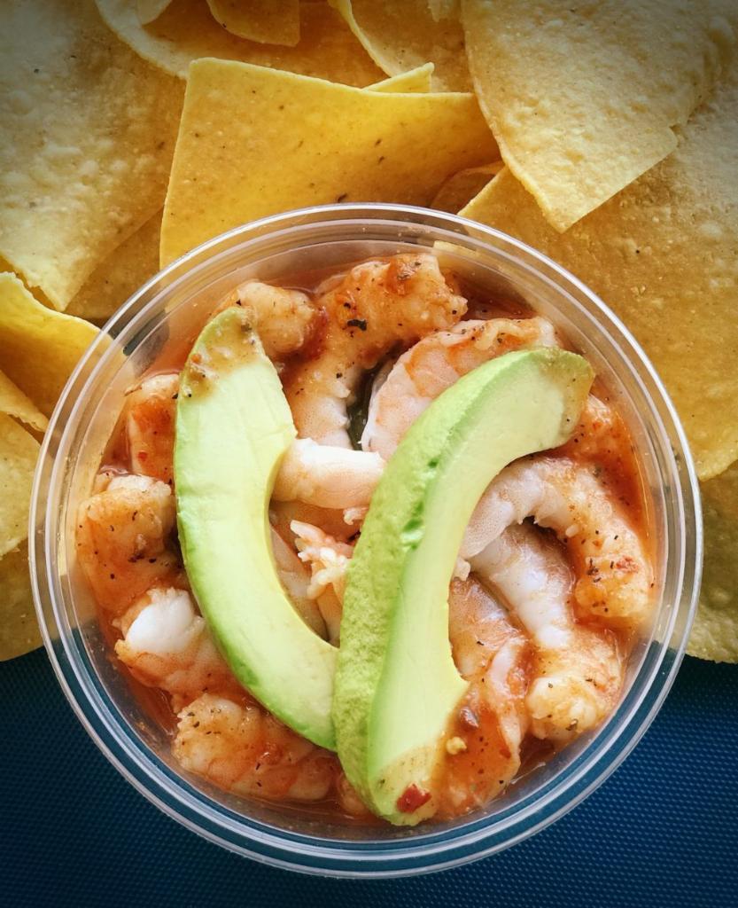 Isaac’s Shrimp Cocktail · Precooked sustainable Argentinian red shrimp, pico de gallo and cucumber in our zesty home-made citrus cocktail sauce topped with avocado slices. Served with home-made corn chips. 