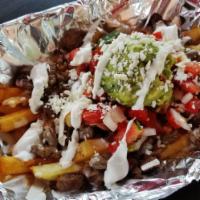 Carne Asada Fries · French fries covered in grilled steak, queso, pico de gallo, guacamole,
Cotija cheese and so...