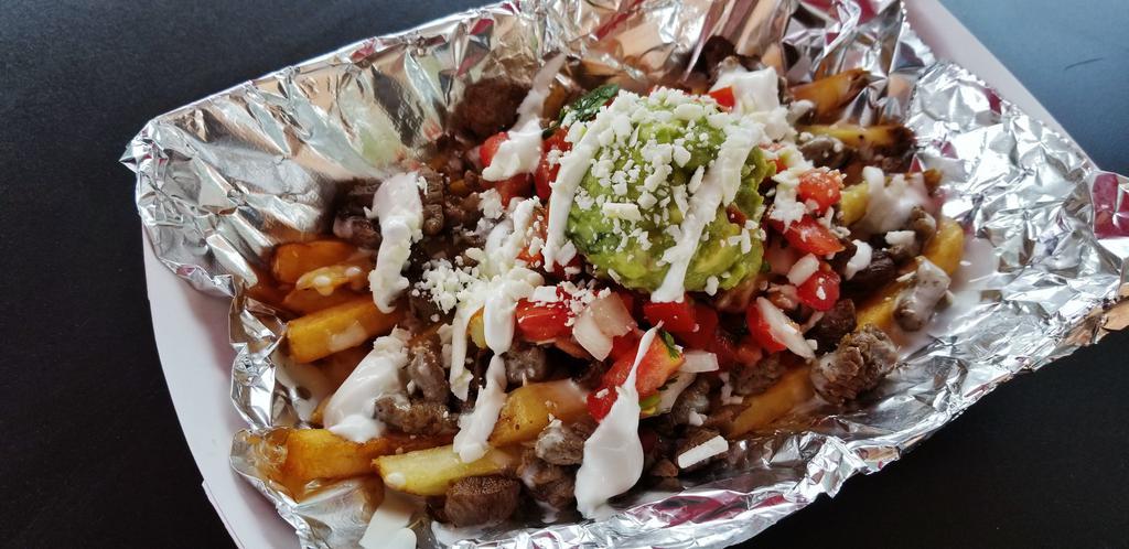 Carne Asada Fries · French fries with grilled steak, queso, pico de gallo, guacamole, Cotija cheese and sour cream.