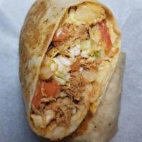 El Dominicano Burrito · Flat grilled burrito filled with shredded chicken, sauteed cabbage, onion and tomato, finish...