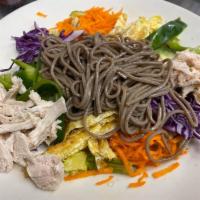 Chicken Rainbow Salad · Shredded chicken, eggs, carrots, green bell pepper, red cabbage, and cucumber served on a be...