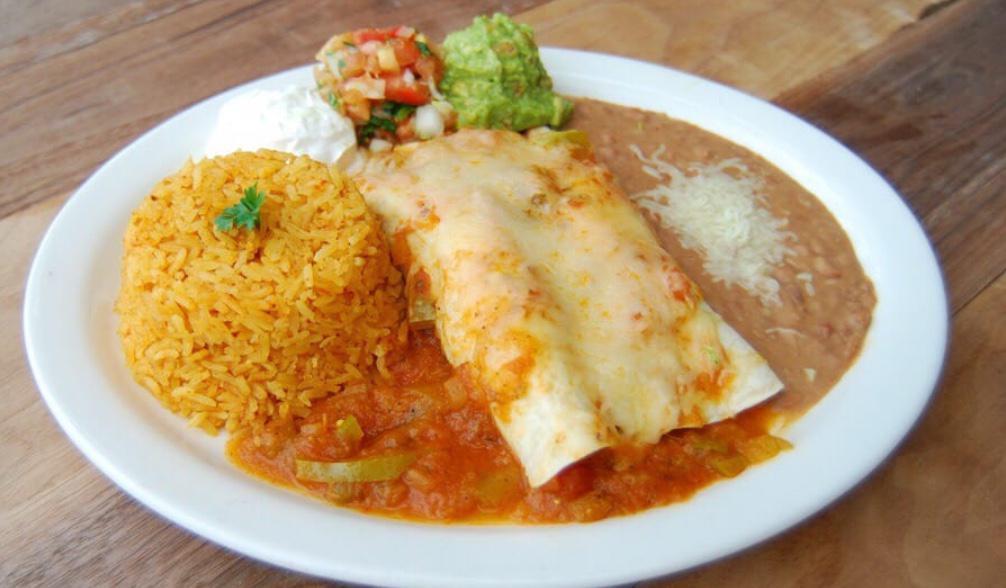 Enchiladas de Fajitas Duos Combo · Two flour tortillas stuffed with your choice of meat, melted Jack cheese and fajita veggies, then topped with our flavorful salsa Ranchera. Served with rice & beans.