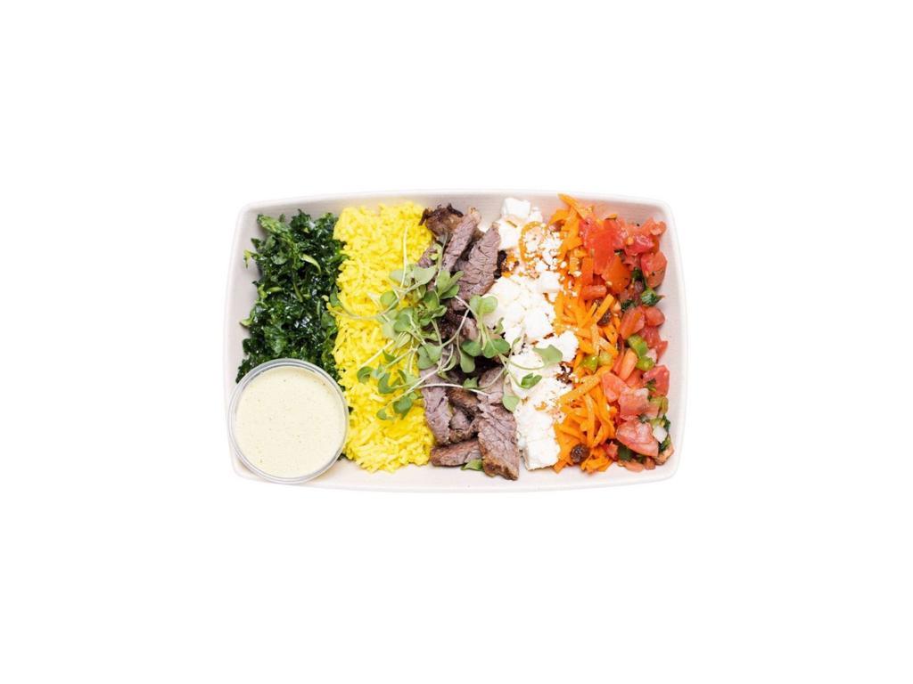 Tri-Tip Steak Bowl · Grilled Tri-tip Steak, turmeric rice, baby spinach, lime tomato vinaigrette, carrots, grilled onions, feta cheese. Cilantro jalapeno dressing.