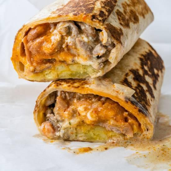 TATER TOT BURRITO · Our special California burrito with tater tots instead of fries! 
( your choice of any meat)