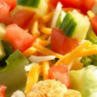 Garden Salad · Spring mix greens piled with diced tomatoes, crisp cucumbers, cheddar cheese, Monterey Jack ...