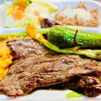 Cecina Dinner · Grilled beef jerky (Rice, beans grilled pepper, grilled onion and Salad).