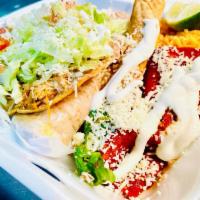 Combinacion Dinner · Shredded beef flauta, chicken tostada, cheese enchilada, and steak taco (Rice and beans).