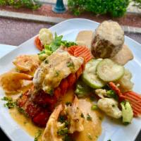 Mar y Tierra · 12 oz. fillet mignon prepared in a black pepper sauce with shrimp and jumbo lump crab cake f...