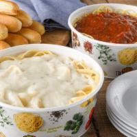 Fresh-Tossed Family Meal · Serves 4. Includes 8 breadsticks. Fettuccine Alfredo and choice of Spaghetti Marinara or Spa...