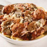 10. Loaded Baked Spaghetti · Spaghetti topped with meat sauce, meatballs, mushrooms, Italian sausage, and bacon.  Baked w...