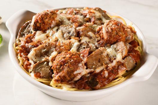 10. Loaded Baked Spaghetti · Spaghetti topped with meat sauce, meatballs, mushrooms, Italian sausage, and bacon.  Baked with mozzarella and provolone cheeses.