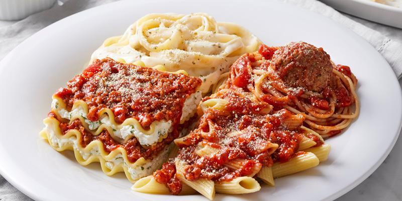 13. Ultimate Sampler · Fettuccine Alfredo, penne with meat sauce, spaghetti and meatball and lasagna with meat sauce.