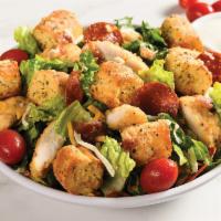 Crispy Chicken Bacon Ranch Salad · Romaine, breaded chicken, bacon, pepperoni chips, breadstick croutons, grape tomatoes, shred...