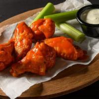 5 Traditional Wings · 5 bone-in wings with your choice of one flavor. Includes celery and your choice of ranch or ...