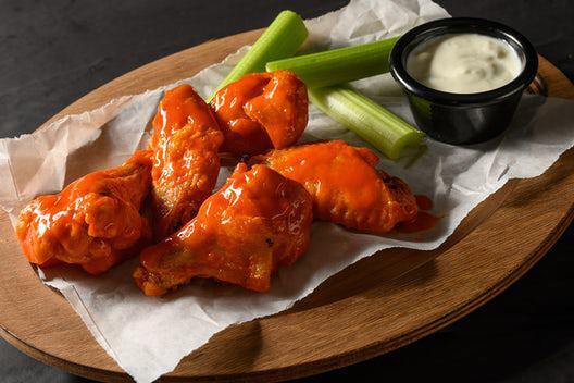 5 Traditional Wings · 5 bone-in wings with your choice of one flavor. Includes celery and your choice of ranch or blue cheese dressing.