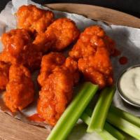 10 Boneless Wings · 10 breaded boneless wings made with breast meat with your choice of two flavors. Includes ce...